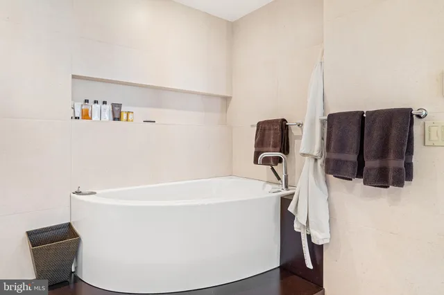 a white bath tub sitting in a bathroom