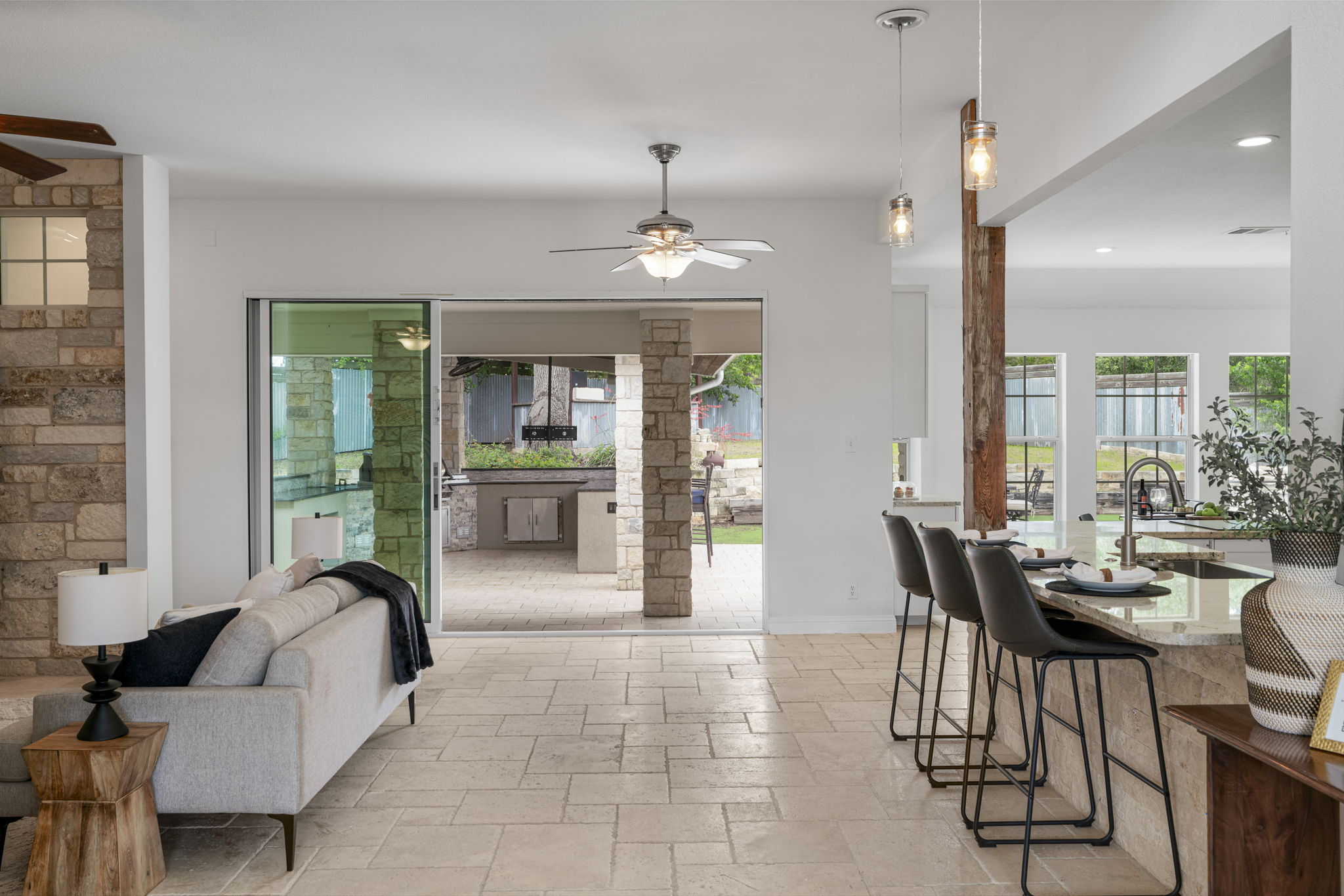 1129 Cedar Pass Road Driftwood, TX 78619 - Photo 8 of 40 Such an open and airy floorpan with direct access to the outdoor living space right off of your kitchen and living area.