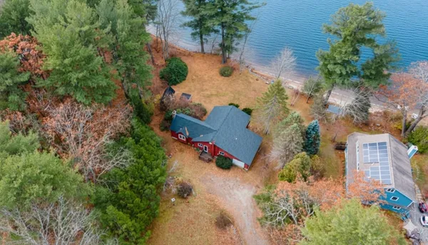 an aerial view of a house with outdoor space