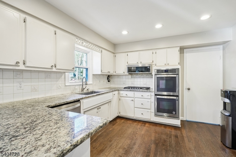 15 Southview Road Randolph, NJ 07869 - Photo 11 of 39 a kitchen with stainless steel appliances granite countertop a stove a sink and a refrigerator