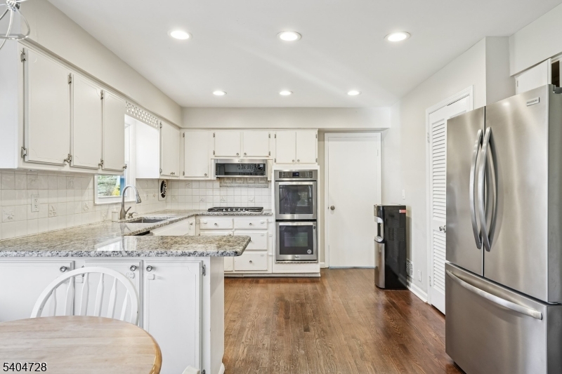 15 Southview Road Randolph, NJ 07869 - Photo 13 of 39 a kitchen with stainless steel appliances granite countertop a refrigerator sink and cabinets