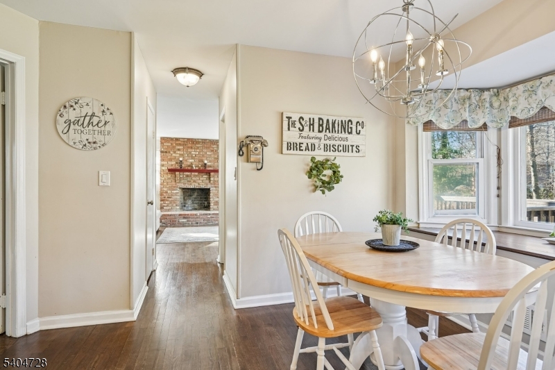 15 Southview Road Randolph, NJ 07869 - Photo 15 of 39 a dining room with furniture a chandelier and wooden floor