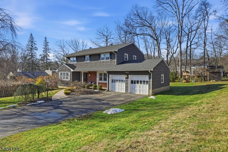 15 Southview Road Randolph, NJ 07869 - Photo 2 of 39 a front view of a house with garden