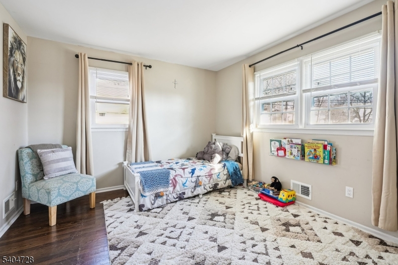 15 Southview Road Randolph, NJ 07869 - Photo 27 of 39 a bedroom with a bed and wooden floor