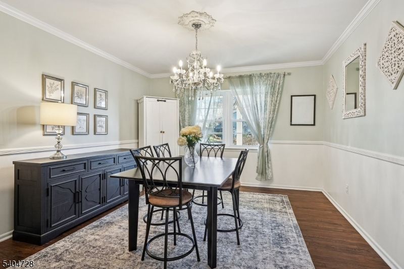 15 Southview Road Randolph, NJ 07869 - Photo 7 of 39 a dining room with furniture a chandelier and wooden floor