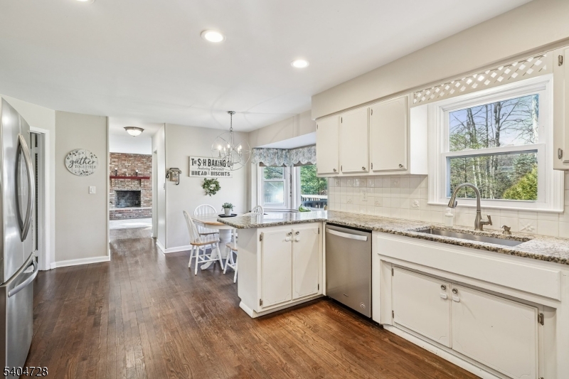 15 Southview Road Randolph, NJ 07869 - Photo 8 of 39 a kitchen with white cabinets and wooden floors