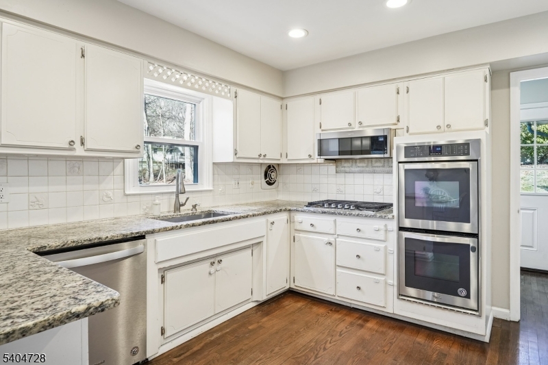 15 Southview Road Randolph, NJ 07869 - Photo 10 of 39 a kitchen with granite countertop white cabinets stainless steel appliances a sink and a window