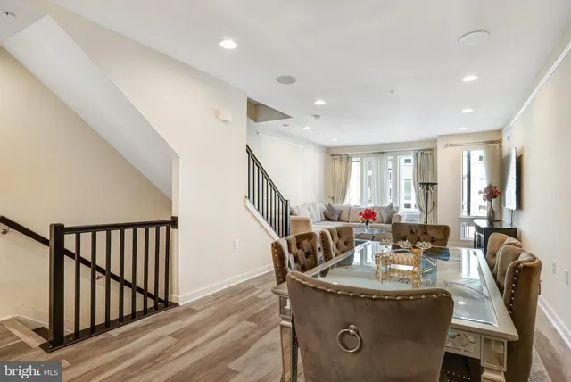 a living room with furniture fireplace and a window