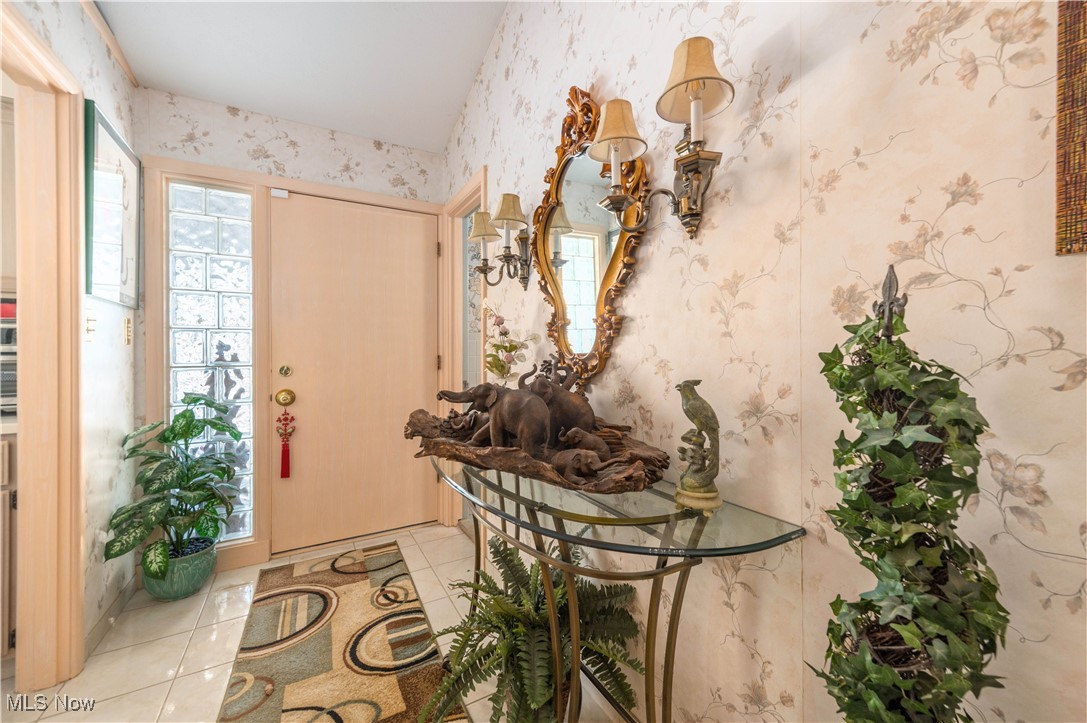2660 Ramsay Road Beachwood, OH 44122 - Photo 4 of 49 Tiled entryway featuring wallpapered walls and plenty of natural light