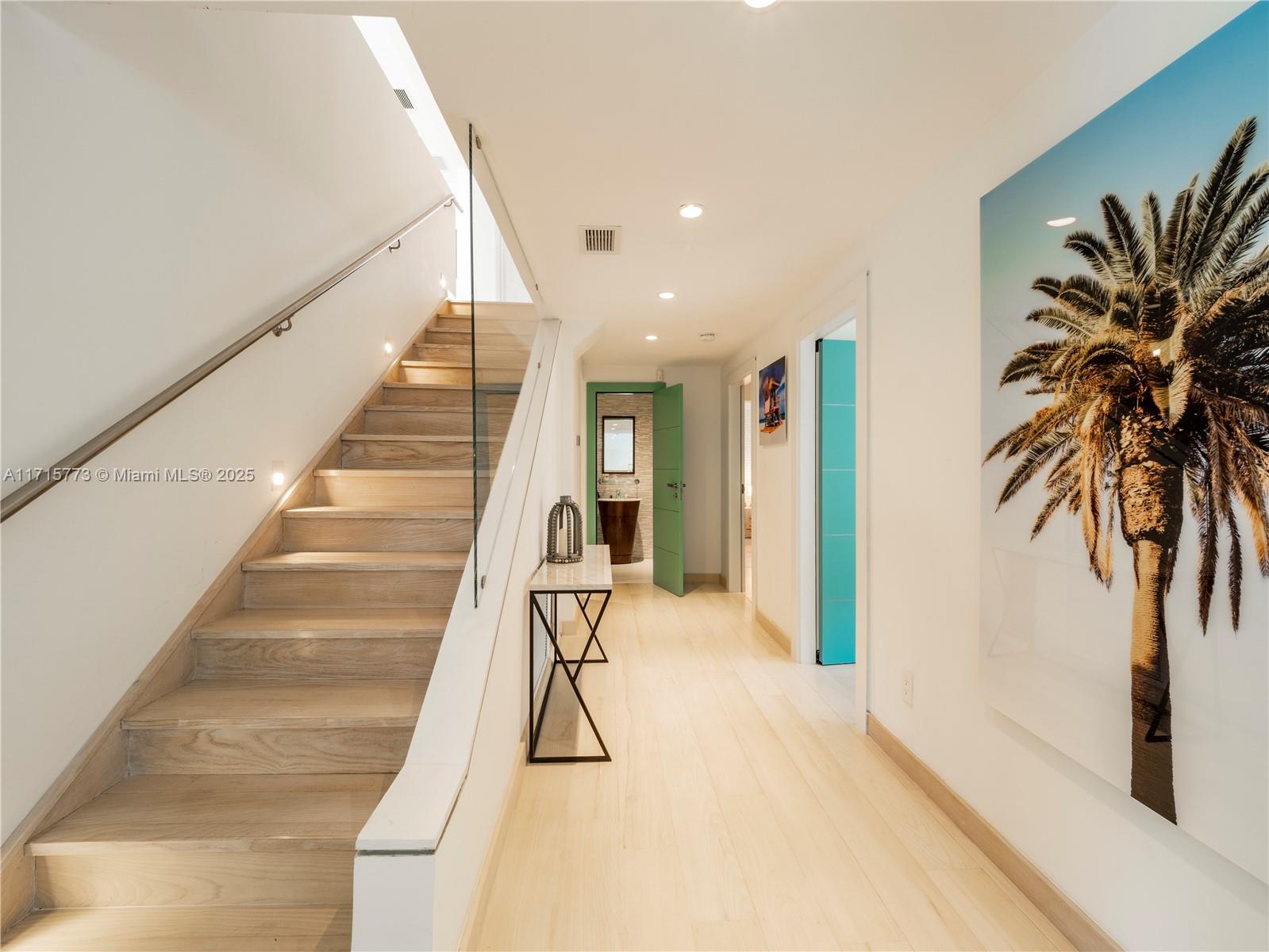 4365 North Bay Road Miami Beach, FL 33140 - Photo 14 of 35 a view of entryway with wooden floor and a rug