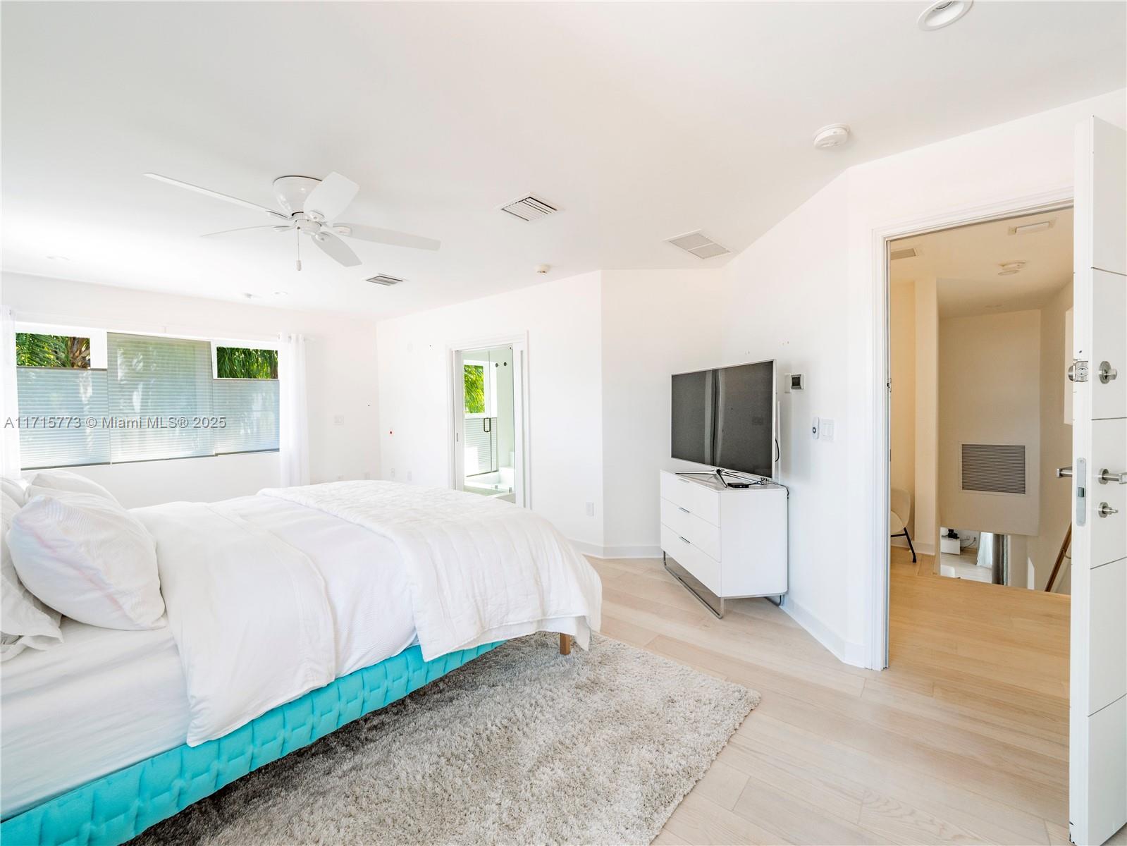4365 North Bay Road Miami Beach, FL 33140 - Photo 17 of 35 a bedroom with a bed and a flat screen tv