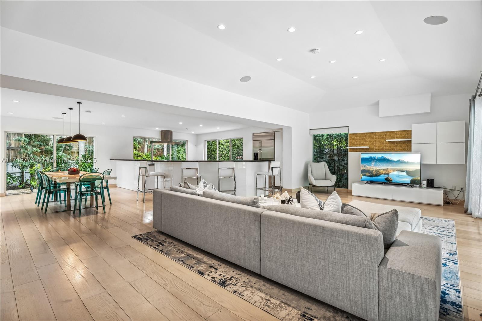 4365 North Bay Road Miami Beach, FL 33140 - Photo 2 of 35 a living room with furniture and a table