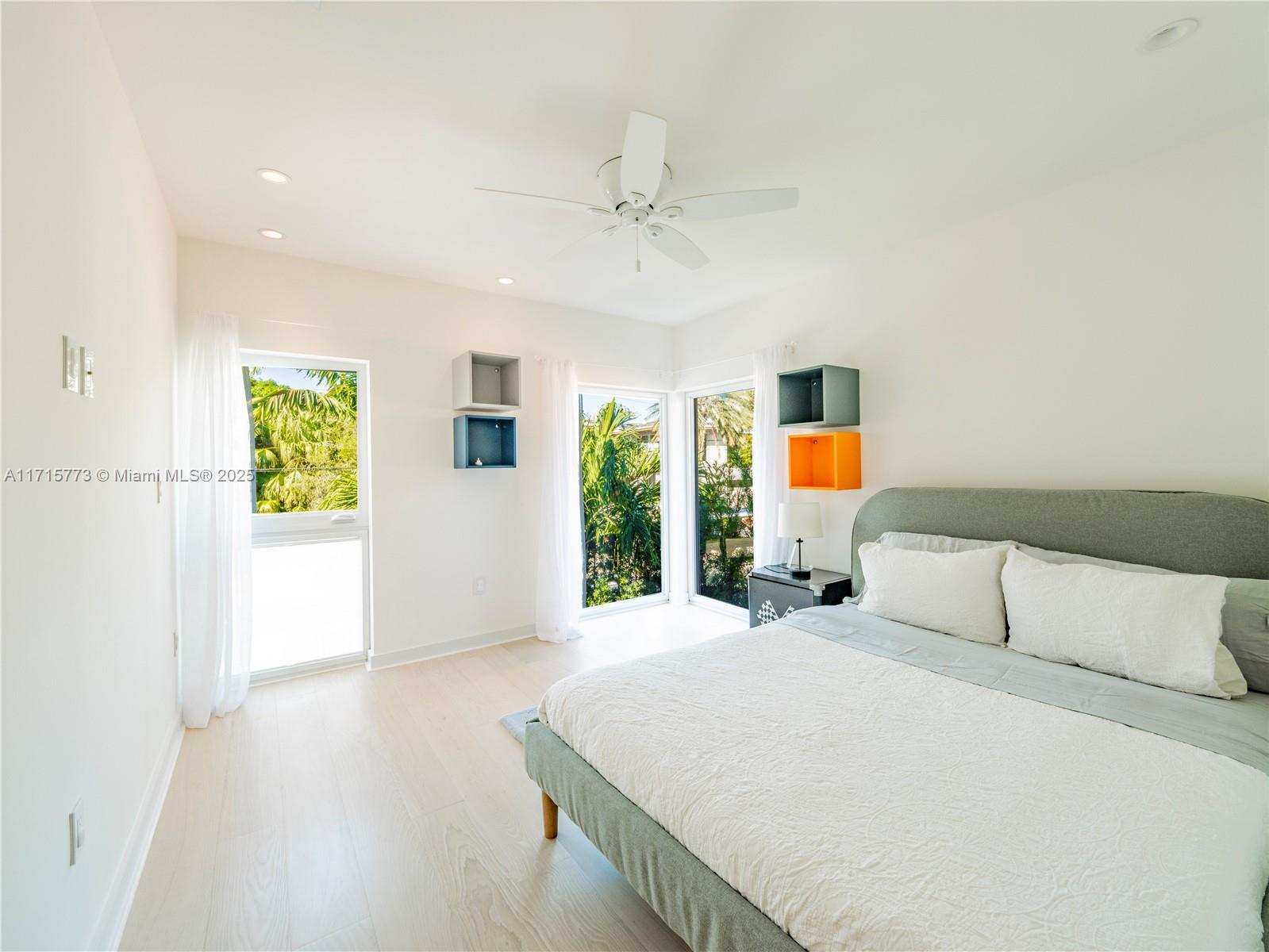 4365 North Bay Road Miami Beach, FL 33140 - Photo 21 of 35 a bedroom with a bed and a window