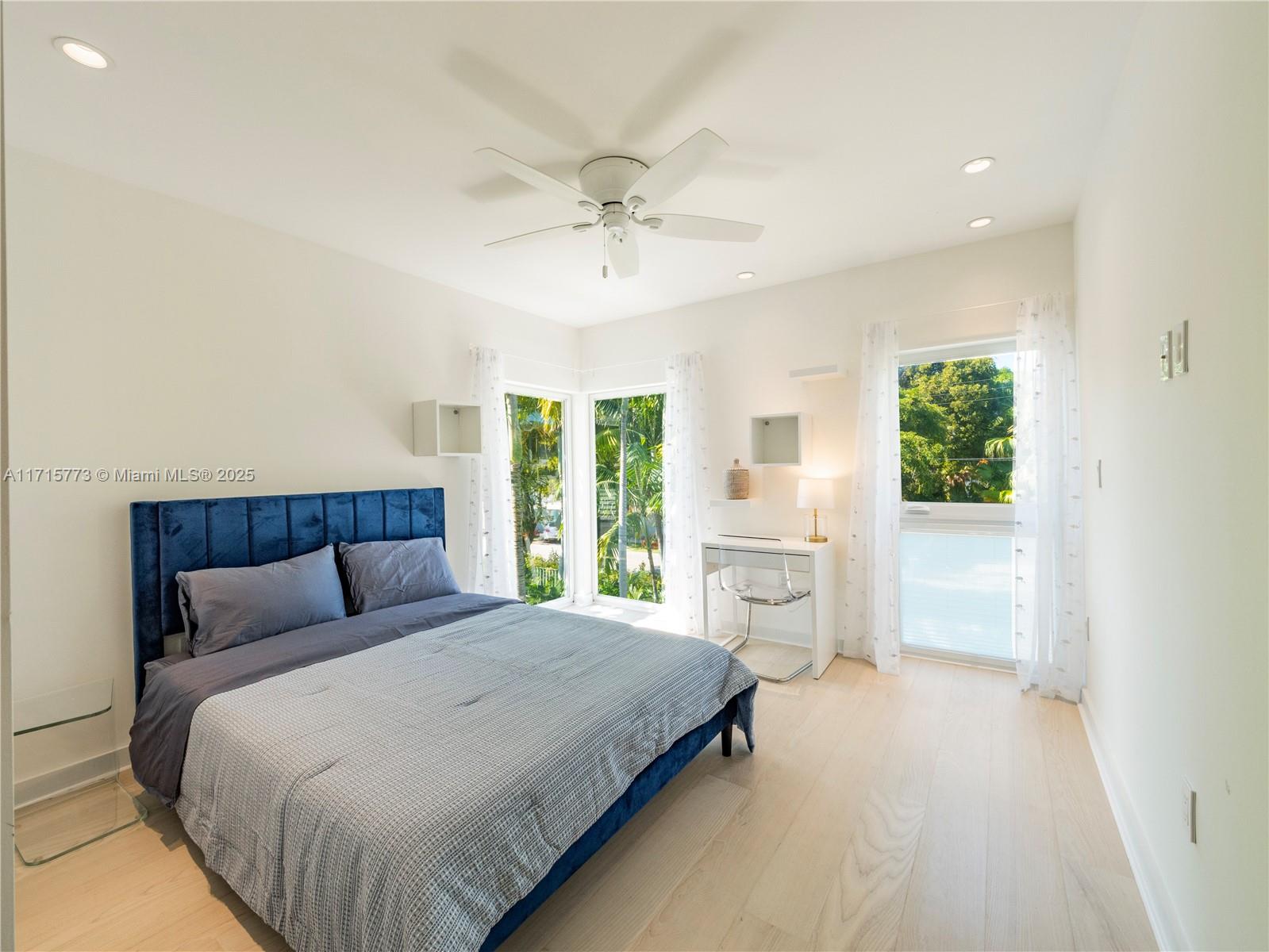 4365 North Bay Road Miami Beach, FL 33140 - Photo 22 of 35 a bedroom with a large bed and a window