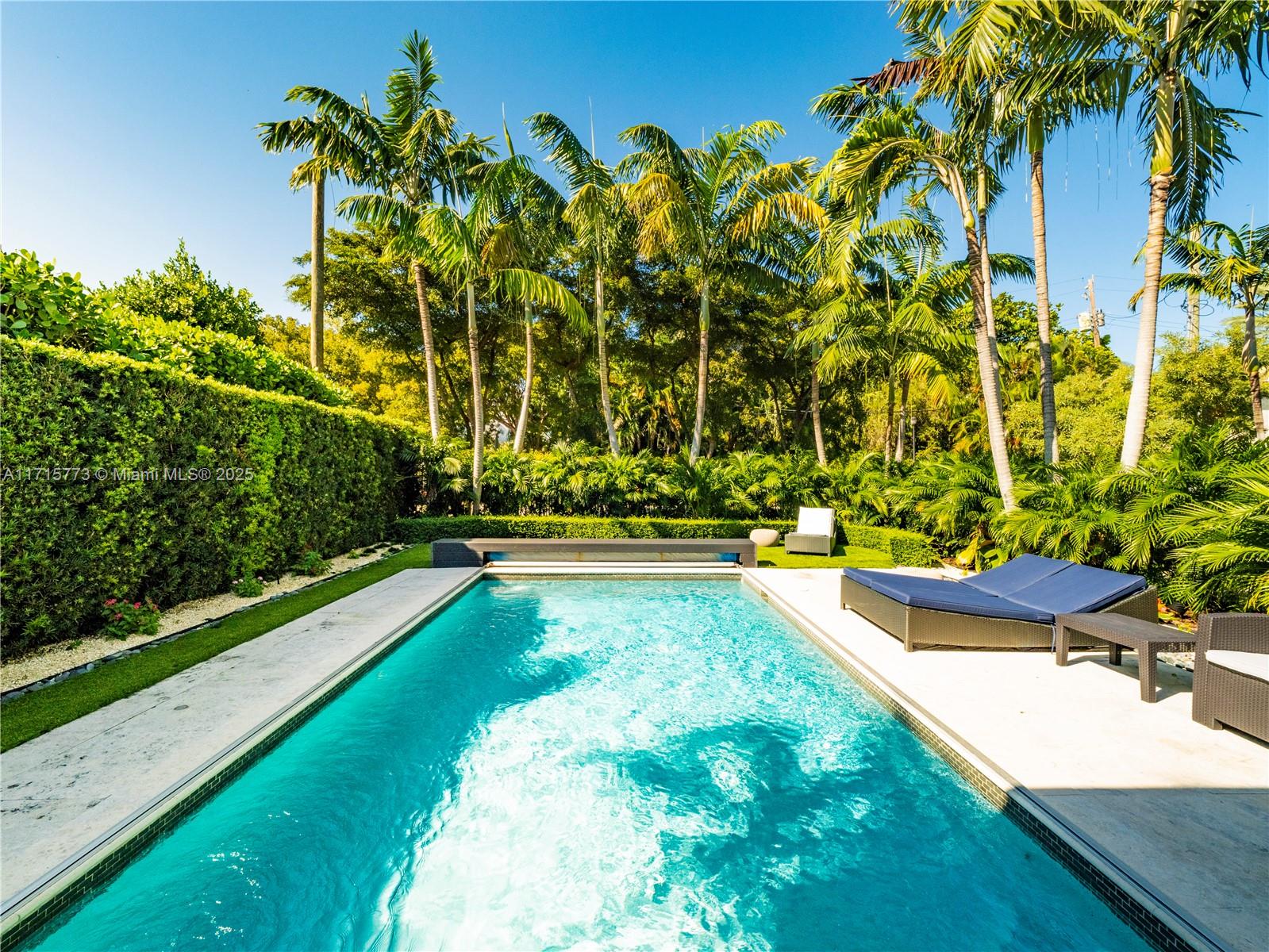 4365 North Bay Road Miami Beach, FL 33140 - Photo 30 of 35 a view of swimming pool with a garden