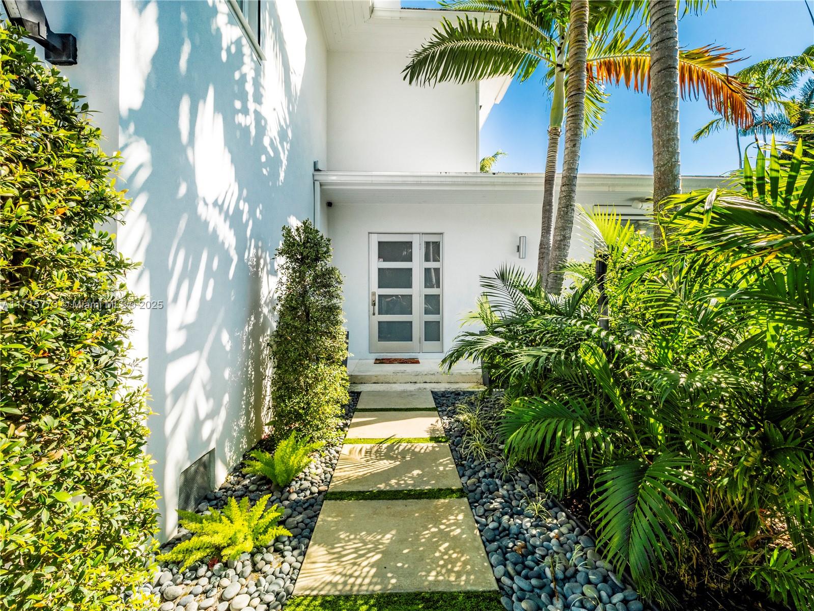 4365 North Bay Road Miami Beach, FL 33140 - Photo 34 of 35 a view of a yard with plants
