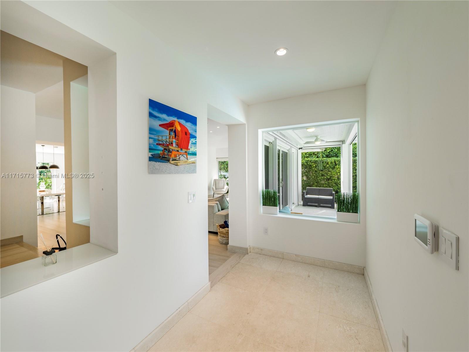4365 North Bay Road Miami Beach, FL 33140 - Photo 7 of 35 wooden floor and window in a room