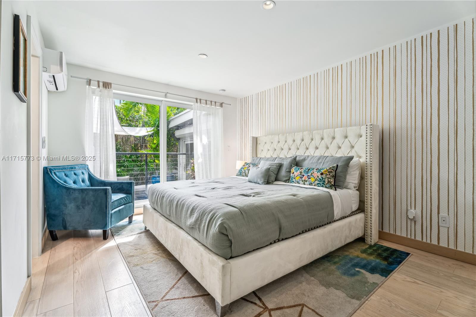 4365 North Bay Road Miami Beach, FL 33140 - Photo 8 of 35 a bed sitting in a bedroom next to a window