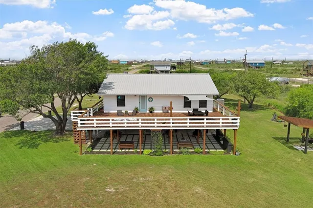 a aerial view of a house with a garden and plants