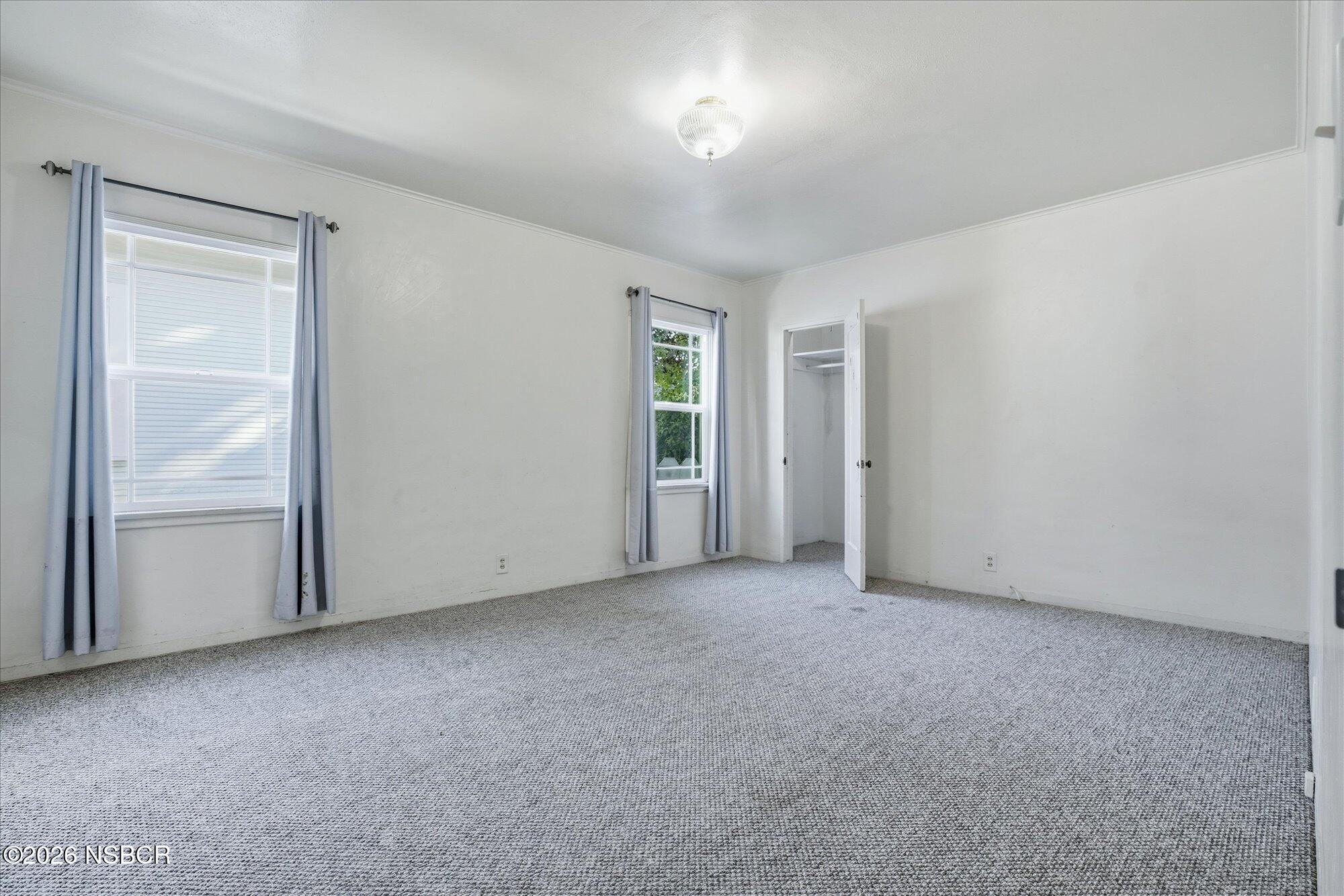 308 West Mill Street Santa Maria, CA 93458 - Photo 12 of 24 an empty room with windows and closet