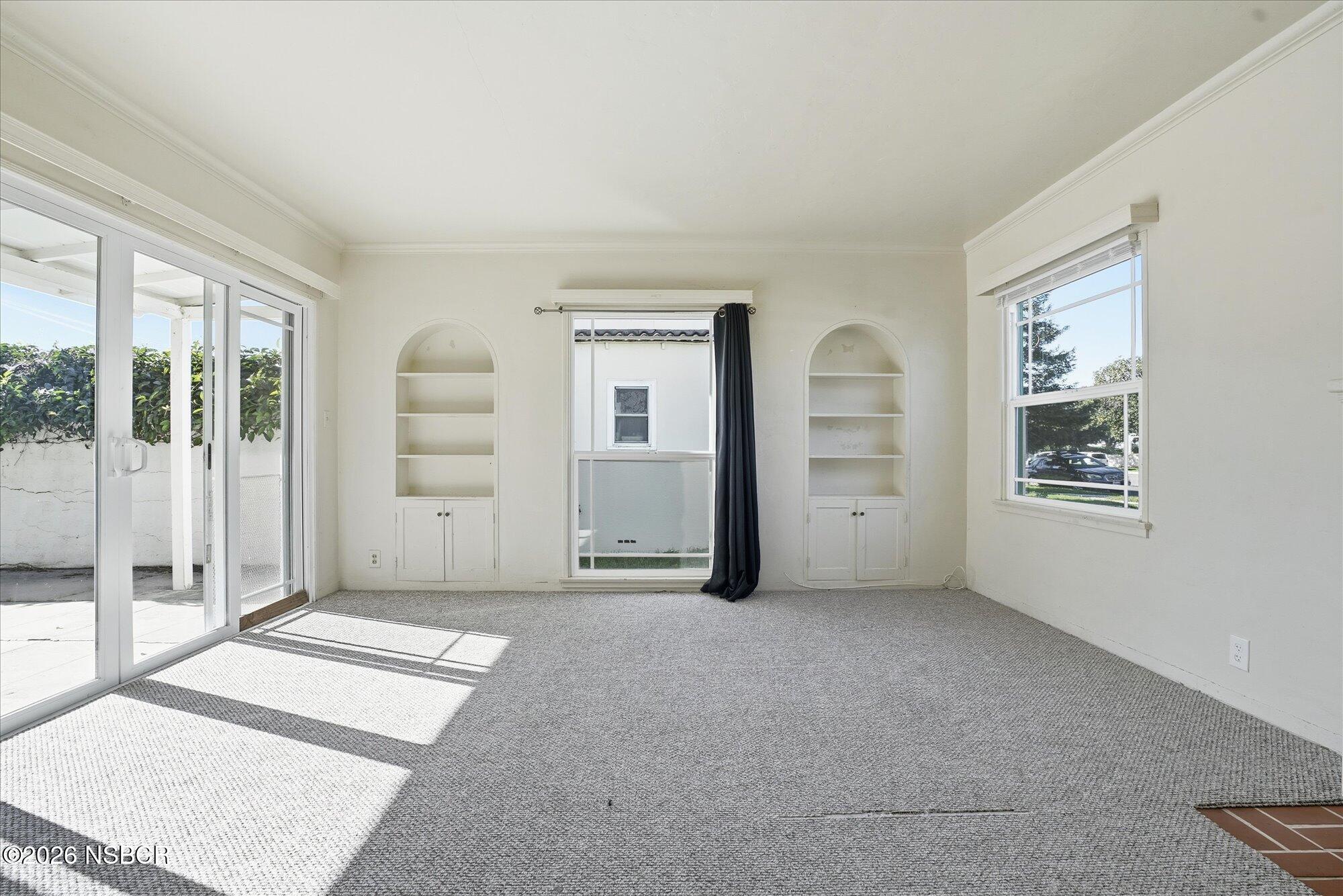 308 West Mill Street Santa Maria, CA 93458 - Photo 4 of 24 a view of an empty room with a window