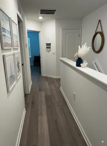 a kitchen with a sink and a refrigerator