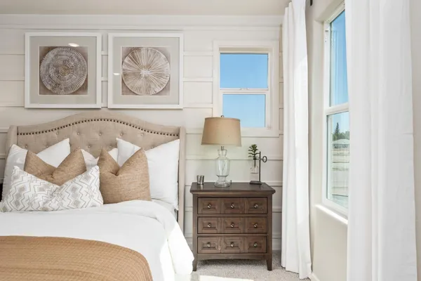 a bedroom with a bed and a cabinets