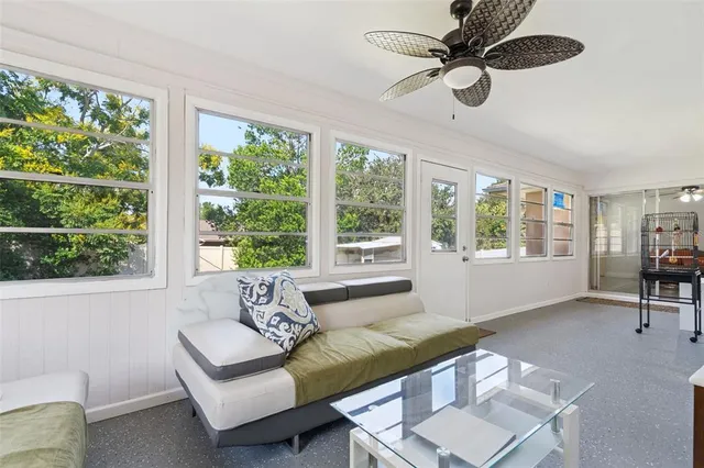 a living room with furniture and a window