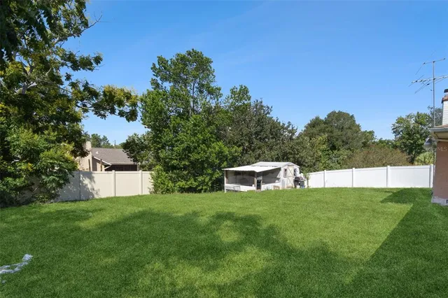 a house view with a sitting space and garden