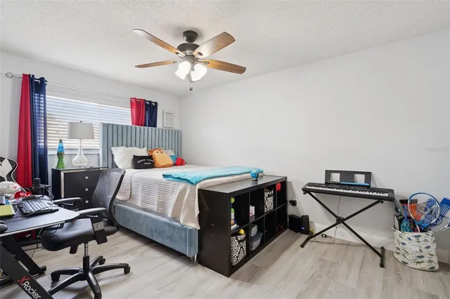 a bedroom with a bed and dresser