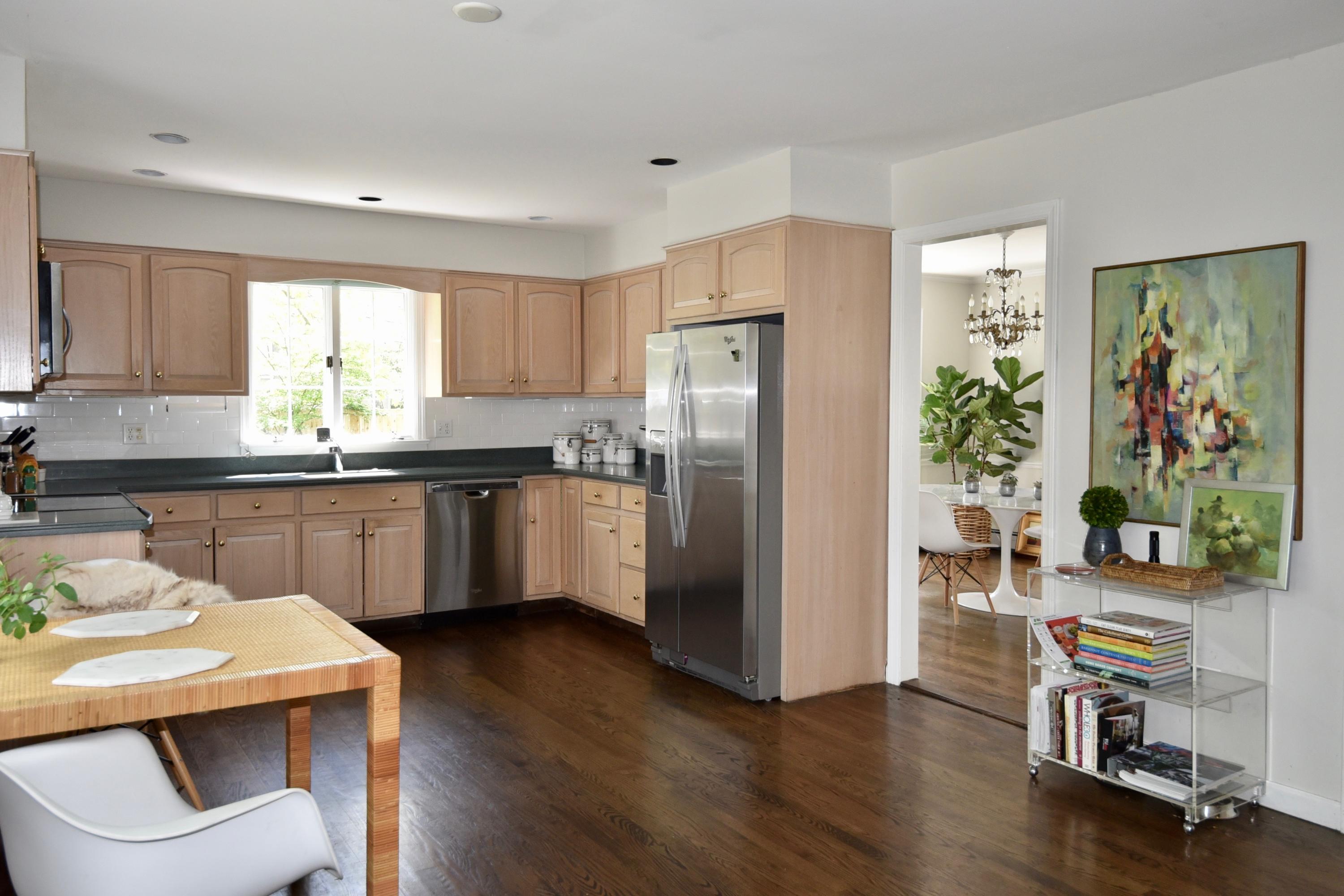 4 Hedge Row Darien, CT 06820 - Photo 2 of 15 a kitchen with granite countertop a refrigerator a sink a stove a dining table and chairs