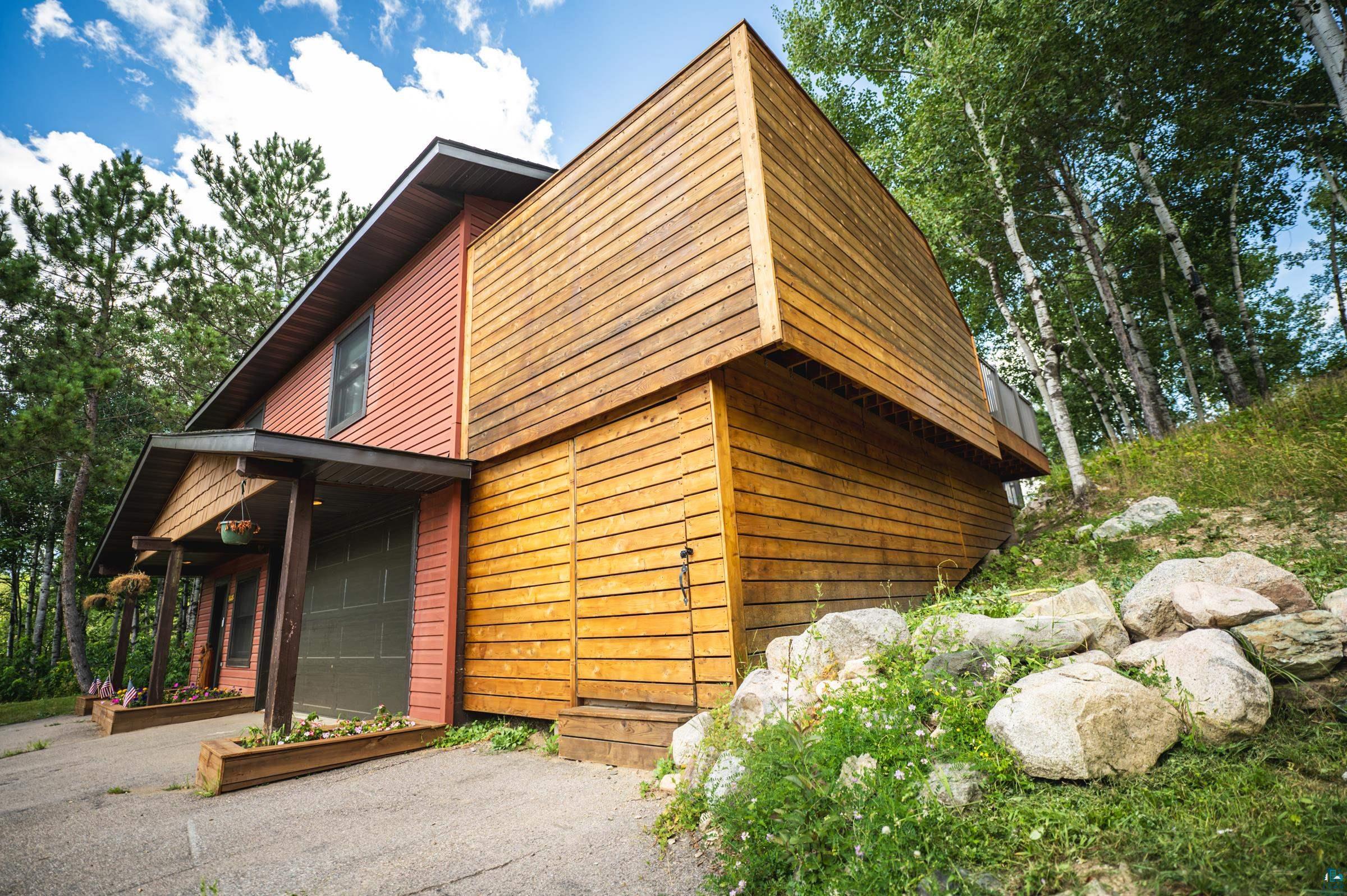 14635 Canadian Border Road Ely, MN 55731 - Photo 3 of 94 Multi-level exterior with horizontal wood siding and vertical siding