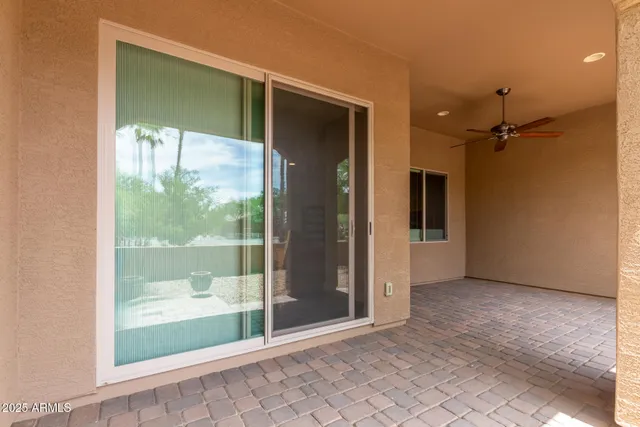 a view of a house with potted plants