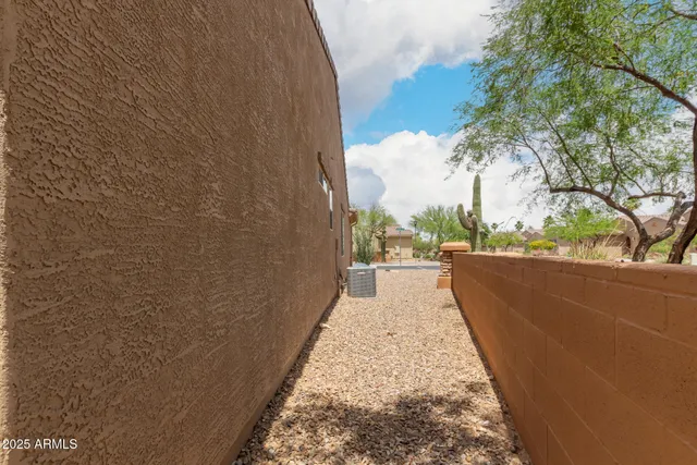 an aerial view of a house with garden space and ocean view