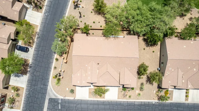 an aerial view of residential houses with outdoor space