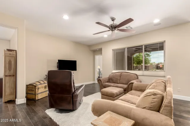 a living room with furniture and a window