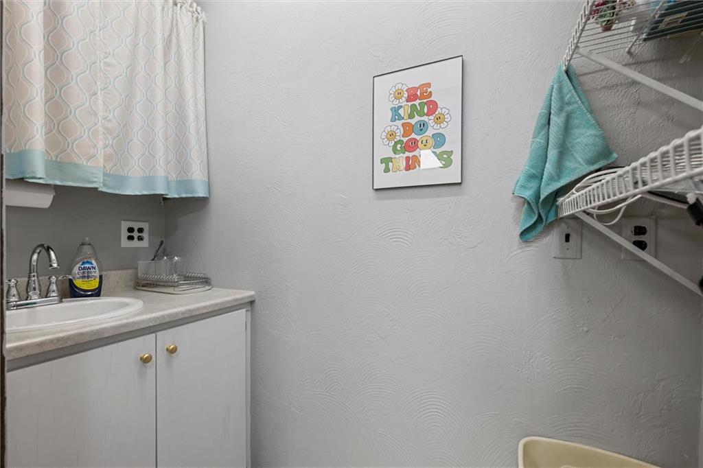 129 North Washington Street Butler, PA 16001 - Photo 17 of 42 a view of a white cabinets and sink