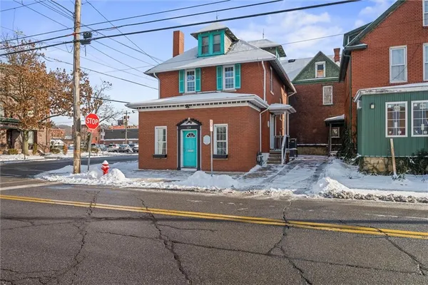 a front view of a house with street