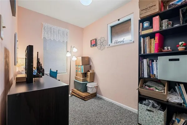 a bathroom with a toilet and a shower curtain