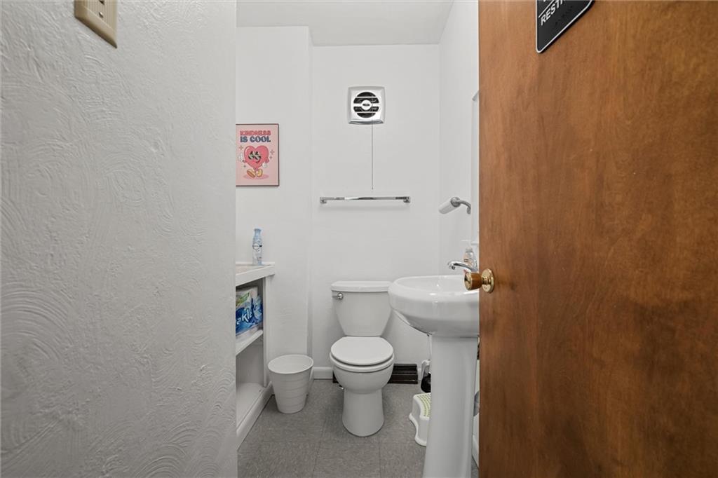 129 North Washington Street Butler, PA 16001 - Photo 24 of 42 a bathroom with a toilet and a shower curtain