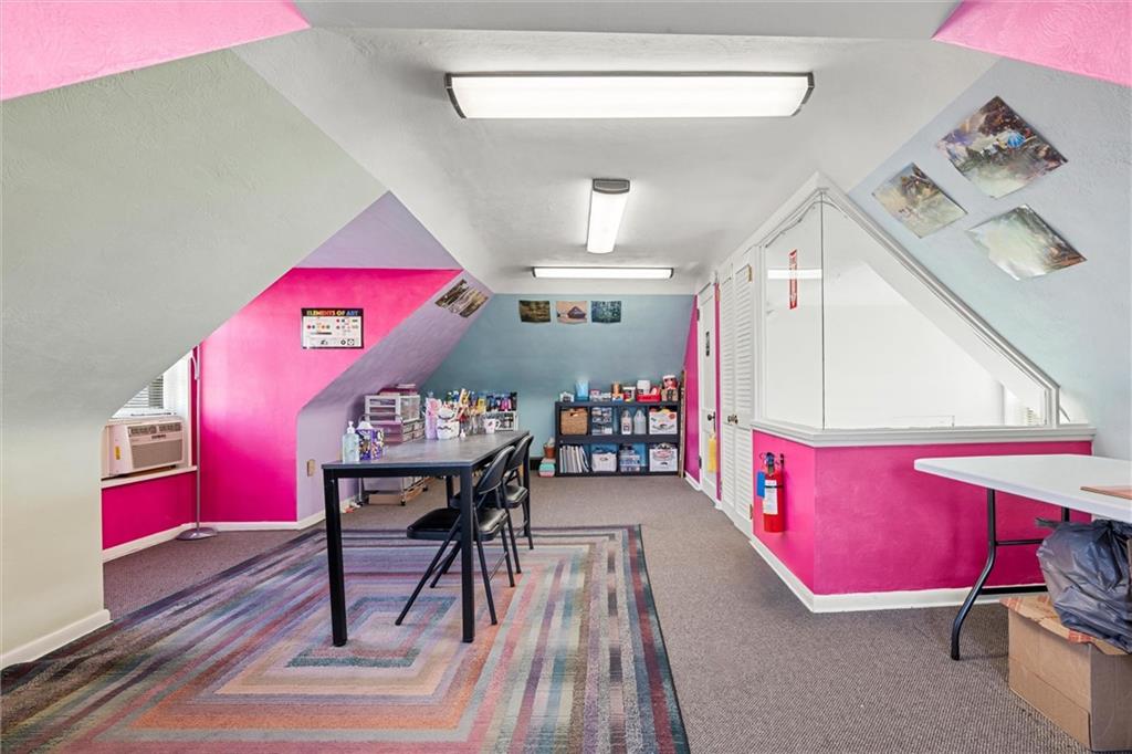 129 North Washington Street Butler, PA 16001 - Photo 26 of 42 a living room with furniture a rug and a wooden floor