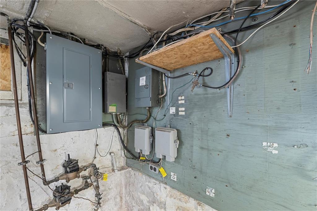 129 North Washington Street Butler, PA 16001 - Photo 34 of 42 a bathroom with a granite countertop sink a mirror and shower