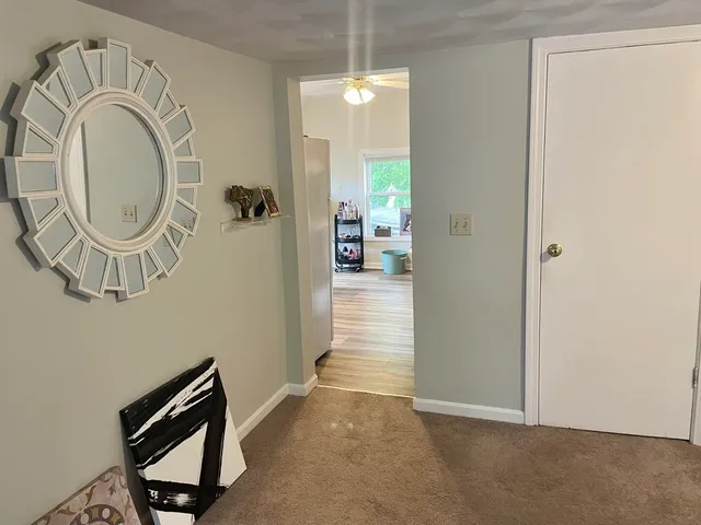 a view of a hallway with washer and dryer