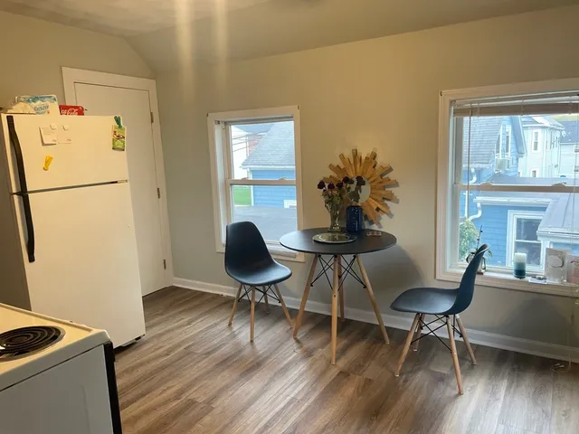 a workspace with furniture and wooden floor