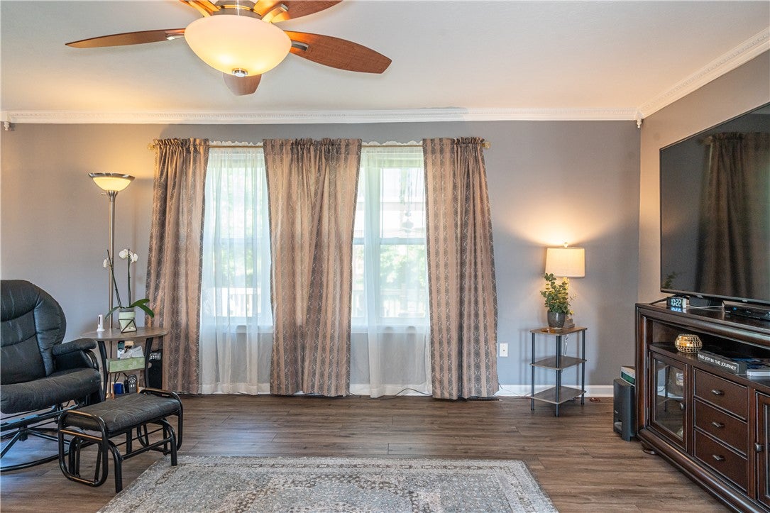 10765 Stone Ridge Way Harrison, OH 45030 - Photo 12 of 68 Hardwood floors and a ceiling fan create a comfortable atmosphere in this well-lit living area.