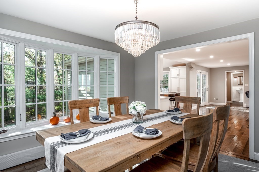 119 Gayland Road Needham, MA 02492 - Photo 15 of 42 a view of a dining room with furniture wooden floor and chandelier