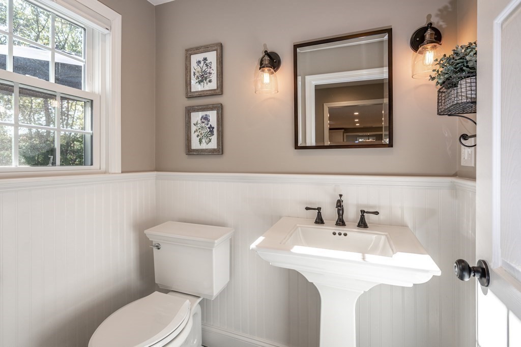119 Gayland Road Needham, MA 02492 - Photo 20 of 42 a bathroom with a toilet sink and mirror