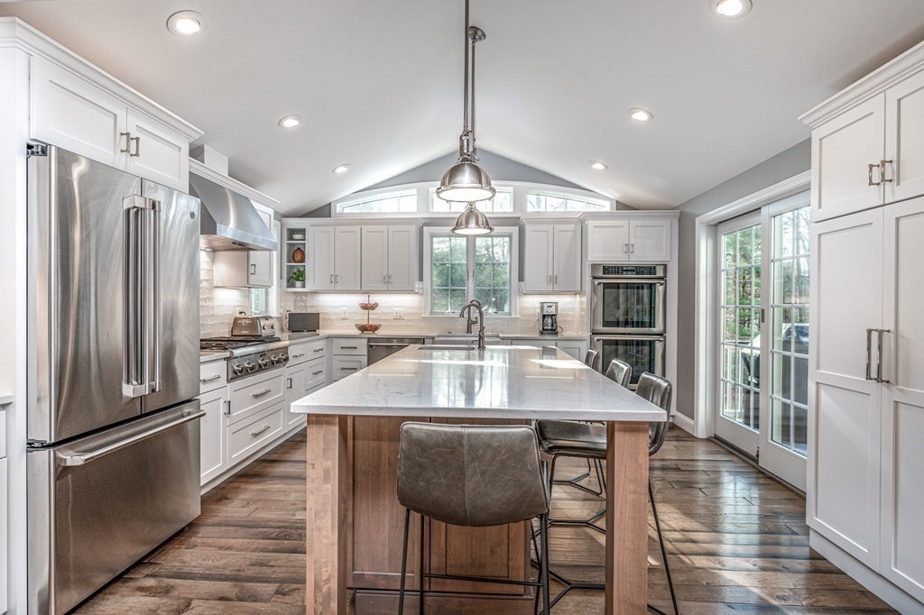 119 Gayland Road Needham, MA 02492 - Photo 2 of 42 a kitchen with granite countertop a center island stainless steel appliances cabinets and a counter top space
