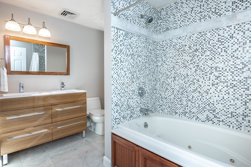 119 Gayland Road Needham, MA 02492 - Photo 24 of 42 a bathroom with a bathtub and a sink