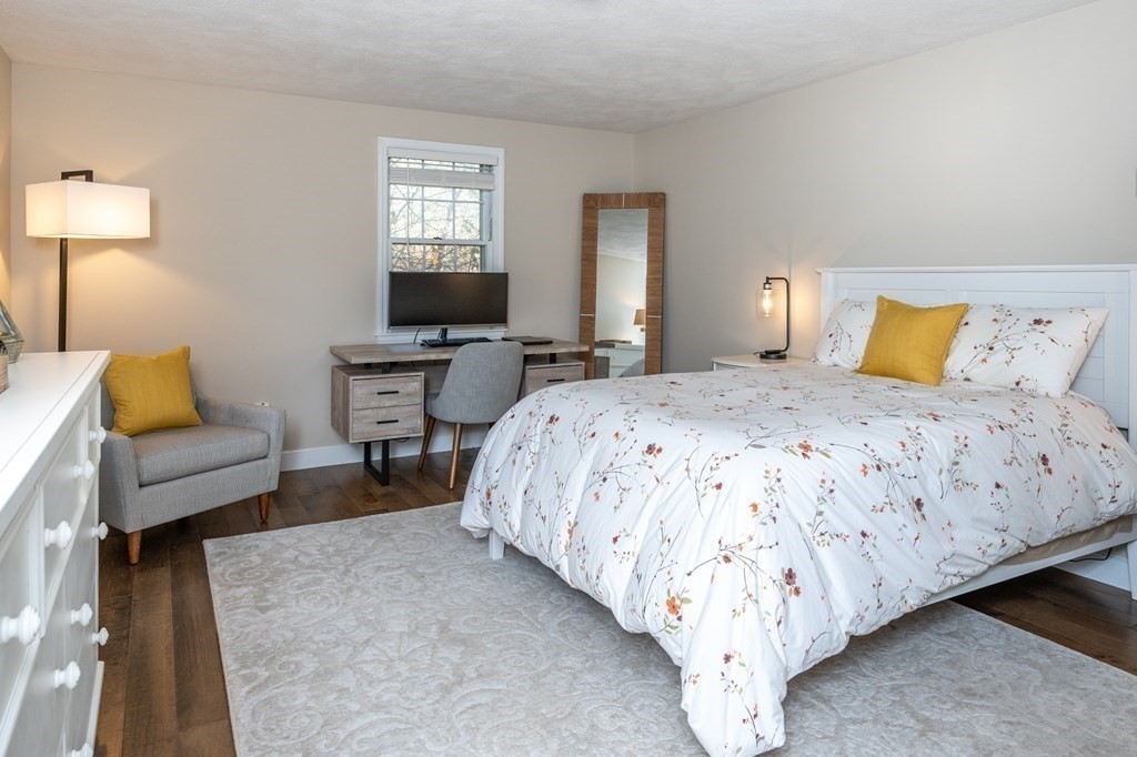 119 Gayland Road Needham, MA 02492 - Photo 30 of 42 a bed room with a bed and a couch